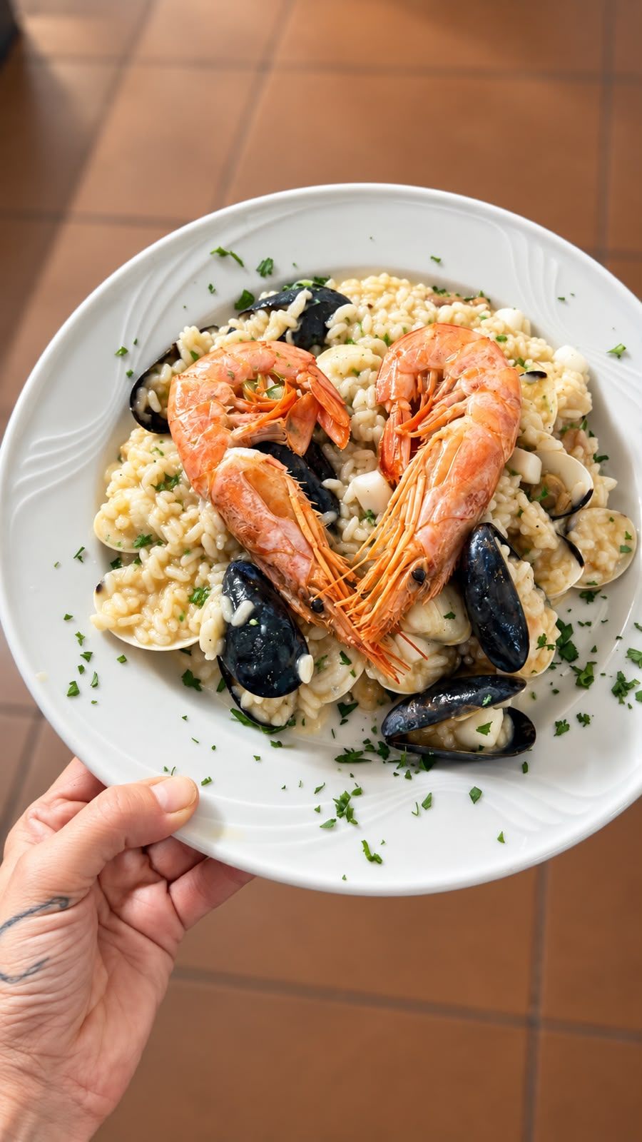 Risotto di mare con gamberi, cozze e vongole